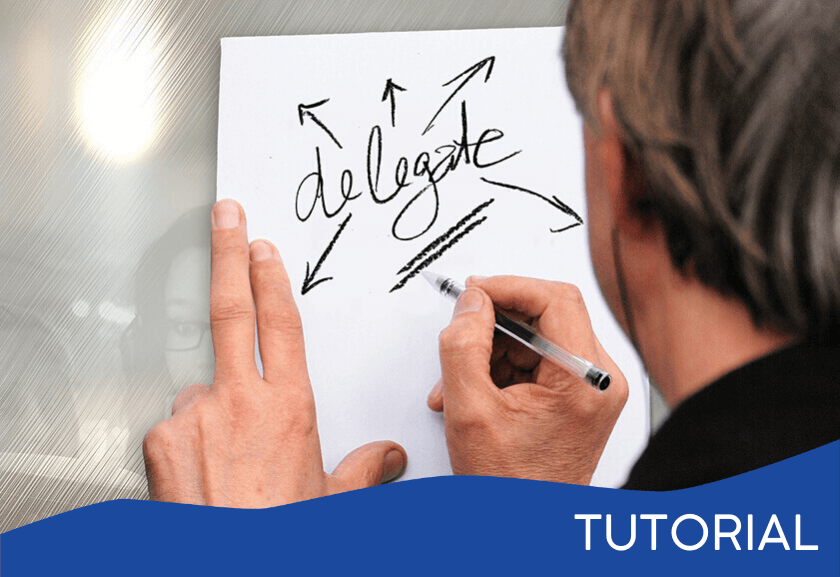 man writing delegate on white board - featured image for the Delegation System tutorial from Truby Achievements