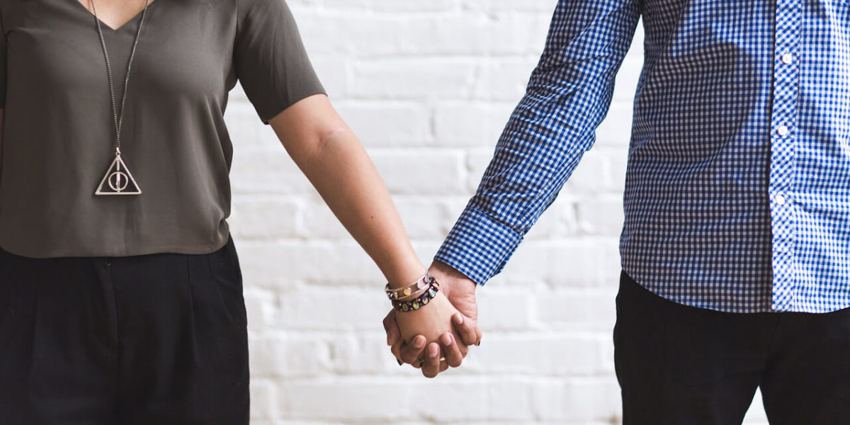 couple holding hands - from How to Start a Relationship Safely article by Truby Achievements