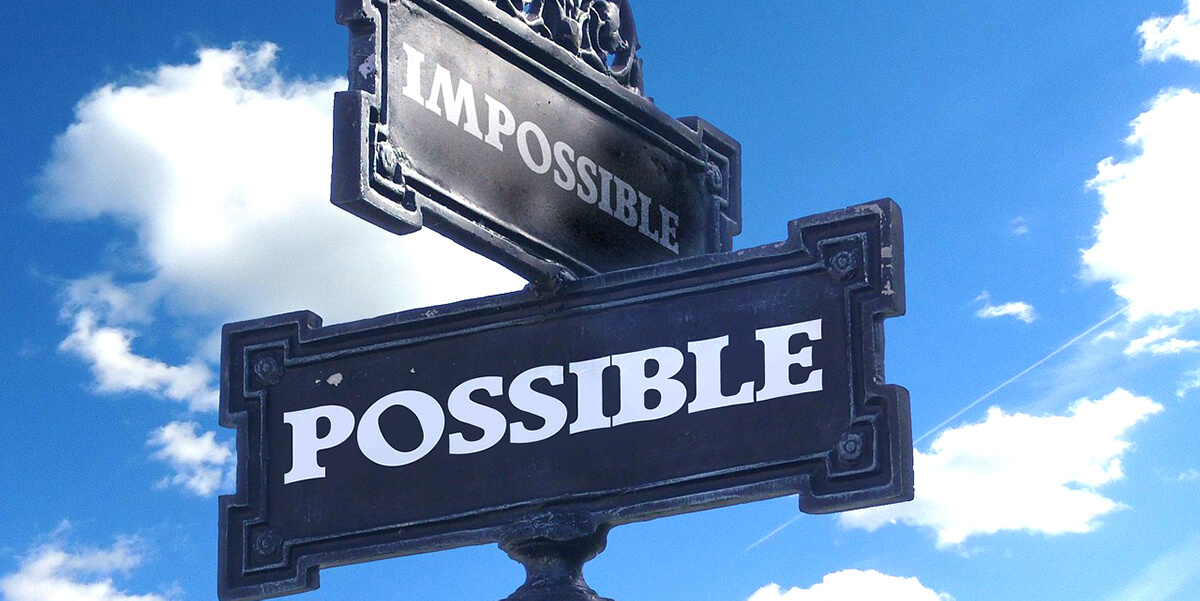 sign post saying impossible and possible representing conflict - for Manage and Resolve Conflict - A Six-Step Process article by Truby Achievement