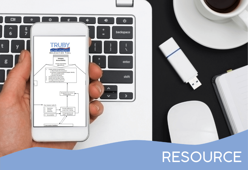 person holding a cell phone with mockup - featured image for Delegation Flow Chart - Tool from Truby Achievements, build your leadership skills