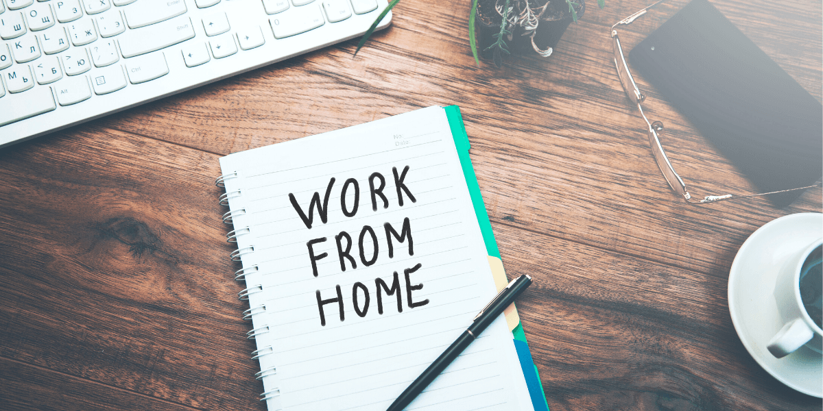 work from home written on a notebook for an article on sanity-saving tips for working from home from Truby Achievements blog