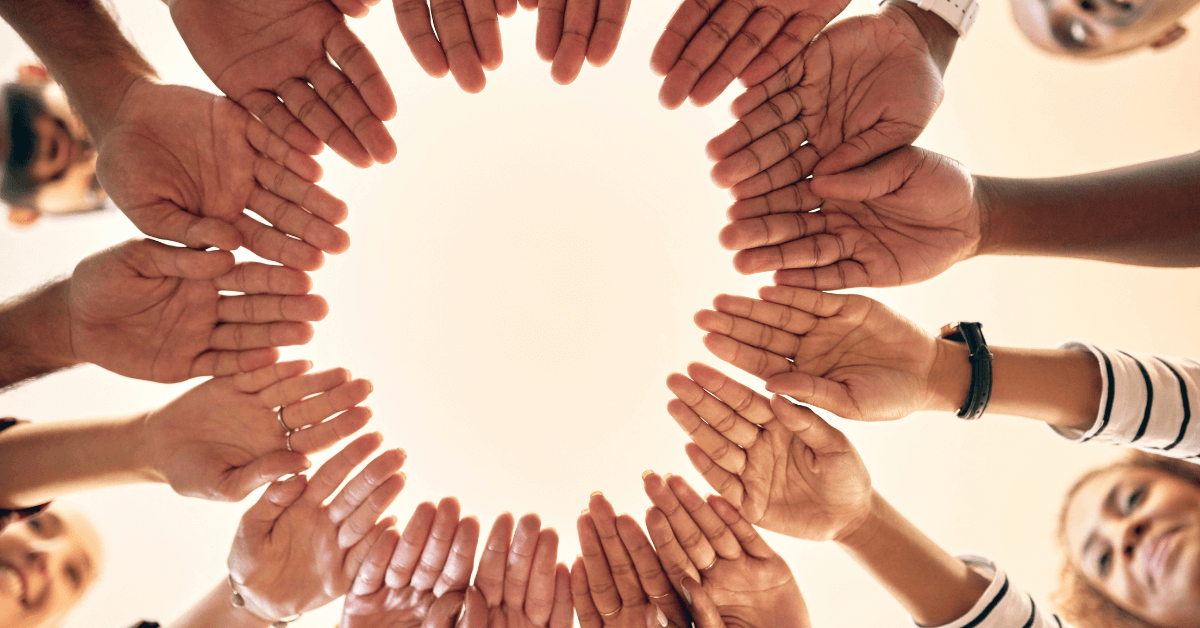 business-consulting-bill-trubys-inner-circle image looking up at people with hands joined in a circle - featured image for Bill Truby's Inner Circle package from Truby Achievements