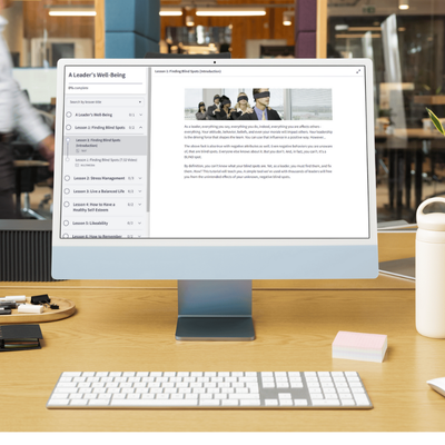 apple desktop in an office showing the first lesson of the leader's well-being course by truby achievements