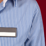 woman in blue and white striped shirt with a blank label - featured image for self-labeling blog by truby achievements
