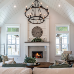 contemporary living room with white walls and tall vaulted ceilings - featured image for changing your environment blog by truby achievements